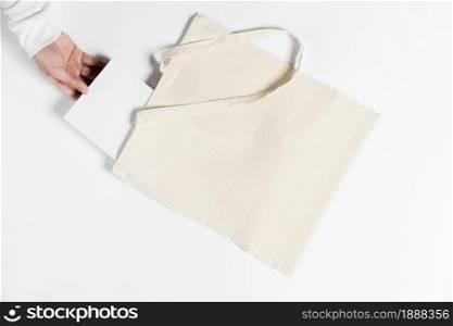 person holding book from tote bag . Resolution and high quality beautiful photo. person holding book from tote bag . High quality and resolution beautiful photo concept