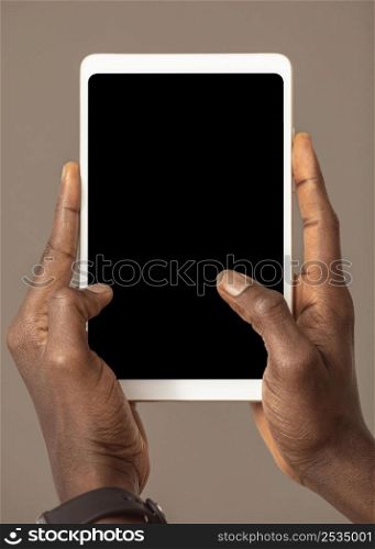 person holding digital tablet vertical position