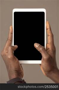person holding digital tablet vertical position