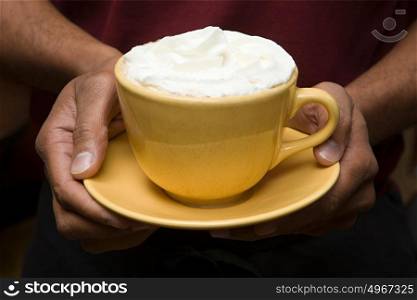 Person holding hot chocolate