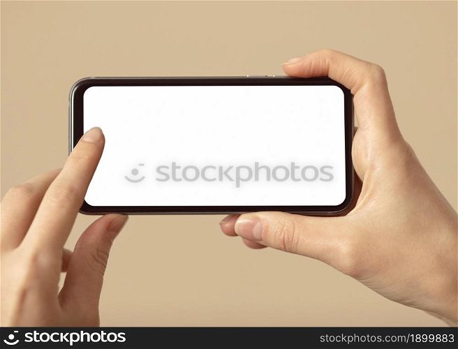 person holding mobile phone with white screen. Resolution and high quality beautiful photo. person holding mobile phone with white screen. High quality beautiful photo concept