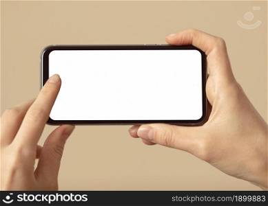 person holding mobile phone with white screen. Resolution and high quality beautiful photo. person holding mobile phone with white screen. High quality beautiful photo concept