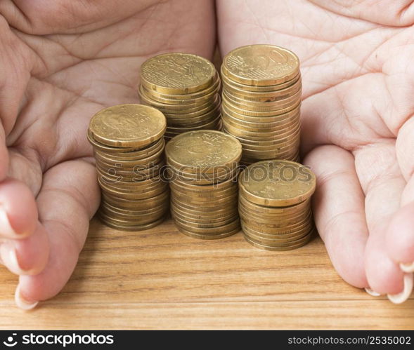 person holding pile coins