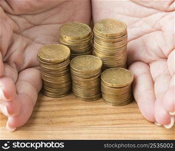 person holding pile coins