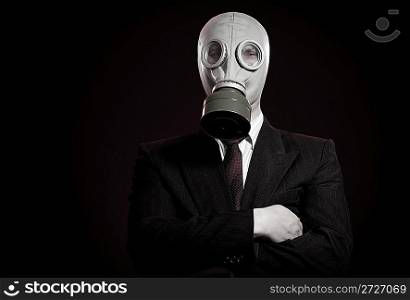 person in a gas mask on a dark background