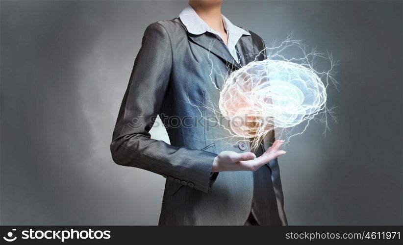 Person of great mind. Close up of businesswoman holding brain concept in palms