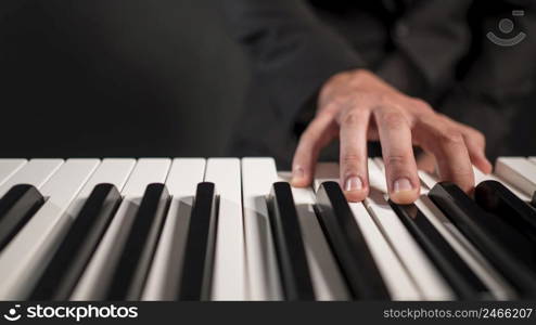 person playing digital piano close up