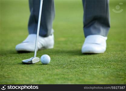 Person playing golf, low section