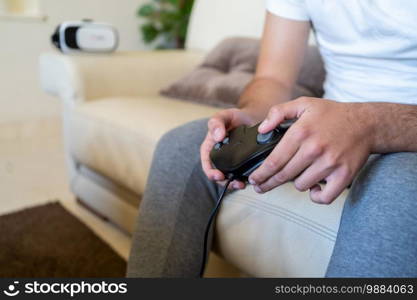 Person playing video games on a sofa