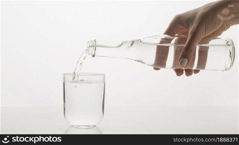 person pouring water glass. Resolution and high quality beautiful photo. person pouring water glass. High quality and resolution beautiful photo concept