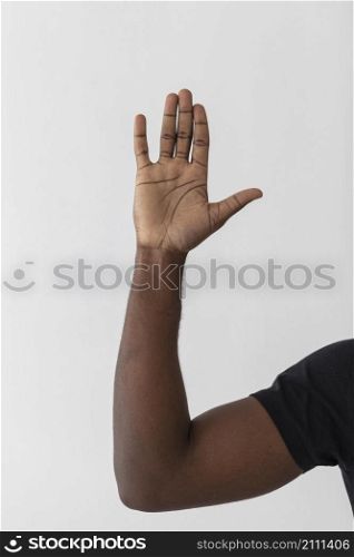 person raising one hand air