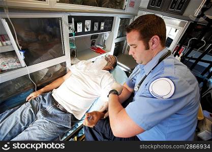 Person Receiving Aid Inside an Ambulance