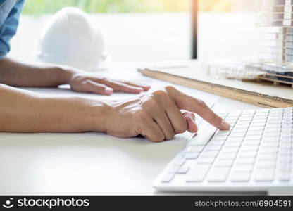 Person&rsquo;s engineer Hand Drawing Plan On Blue Print or working project in his office with architect equipment