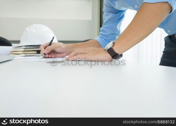 Person&rsquo;s engineer Hand Drawing Plan On Blue Print with architect equipment