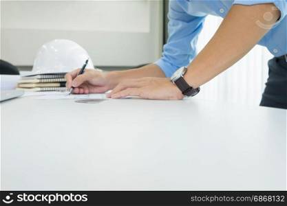 Person&rsquo;s engineer Hand Drawing Plan On Blue Print with architect equipment