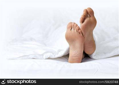 Person&rsquo;s foot in bed