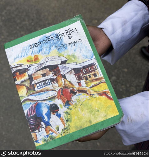 Person showing a book, Punakha, Bhutan