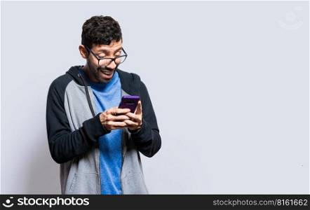 Person smiling and using cell phone isolated, person in glasses smiling using smartphone on isolated background, guy in glasses smiling at cell phone isolated