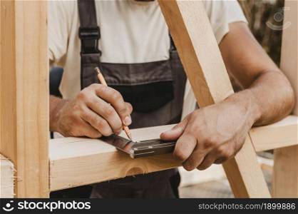 person taking measures wood 2. Resolution and high quality beautiful photo. person taking measures wood 2. High quality beautiful photo concept