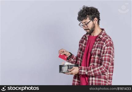Person taking out credit card from his wallet, people taking out his debit card from his wallet on isolated background, concept of person paying with credit card with copy space