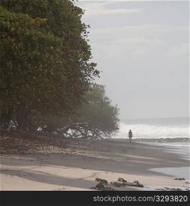 Person walking on the beach in Costa Rica