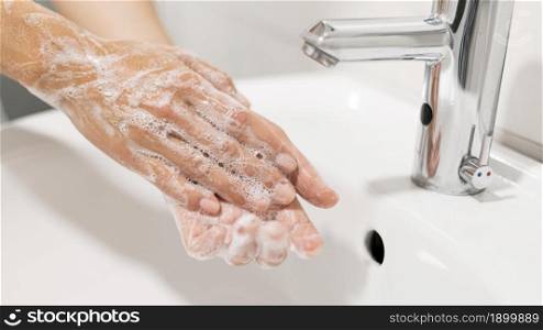 person washing hands with soap. Resolution and high quality beautiful photo. person washing hands with soap. High quality beautiful photo concept