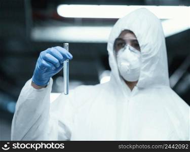 person wearing prevention suit while taking samples