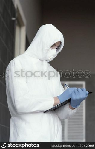 person wearing protective equipment against bio hazard