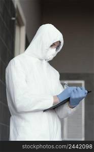 person wearing protective equipment against bio hazard