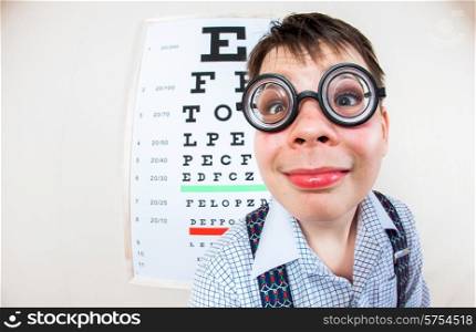 Person wearing spectacles in an office at the doctor