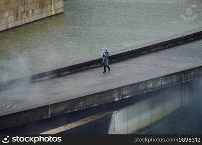                                 person with an umbrella in rainy days in winter season