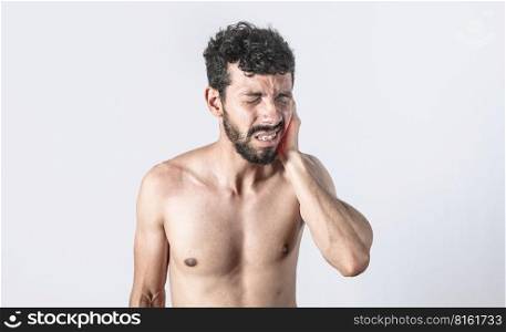 Person with earache on isolated background, man with earache on isolated background, ear disease concept