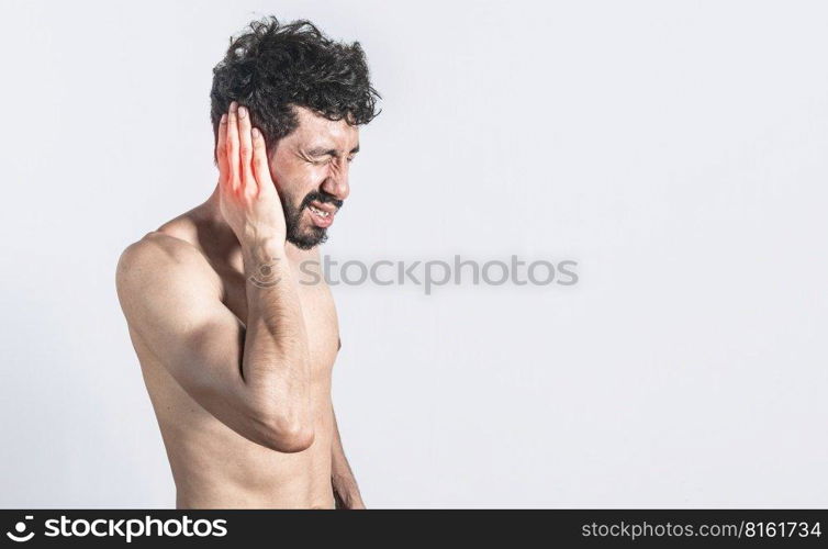 Person with earache on isolated background, man with earache on isolated background, ear disease concept