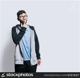 Person wondering with hand on chin isolated, Thoughtful person rubbing his chin, Concept of wondering man with doubt face