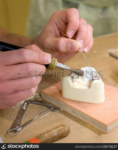 Person working with metal tool