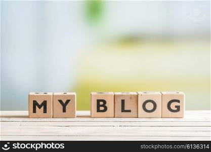 Personal blog sign on a wooden indoor table