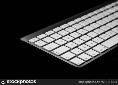 Personal computer keyboard on black background