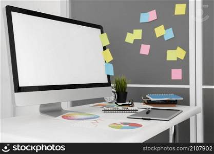 personal computer office workspace with sticky notes