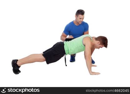 Personal trainer and boy making push-ups isolated on a white background