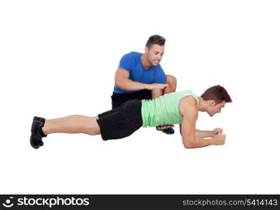 Personal trainer and boy making push-ups isolated on a white background