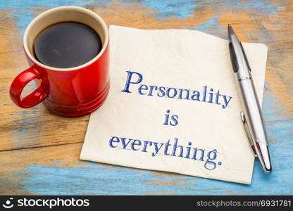 Personality is everything - handwriting on a napkin with a cup of coffee
