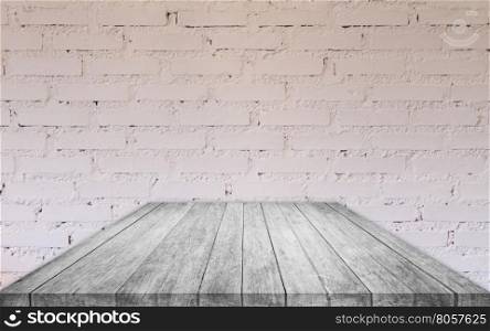 Perspective black and white wooden table top with brick wall decorated in coffee shop