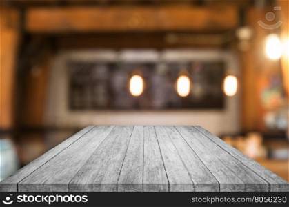 Perspective black and white wooden table top with coffee shop blurred abstract background