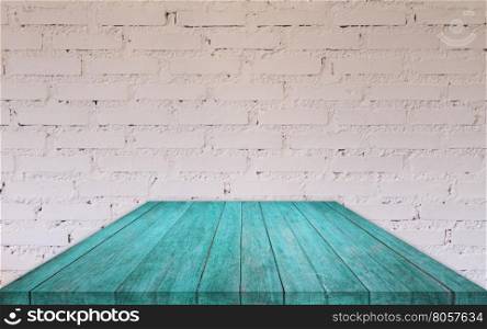 Perspective blue wooden table top with brick wall decorated in coffee shop