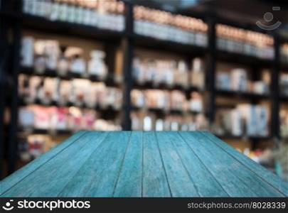 Perspective blue wooden with coffee shop blurred background with bokeh, stock photo