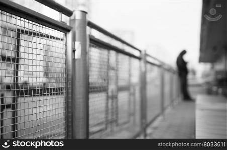Perspective fence with man in background