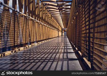 Perspective of a metal walkway.