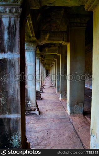 Perspective of ancient colonnade in Angkor Wat, Siem Reap, Cambodia