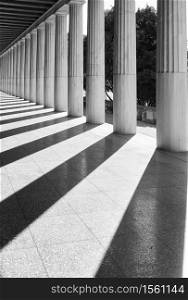 Perspective of classical greek columns, Athens, Greece. Black and white architectural photography