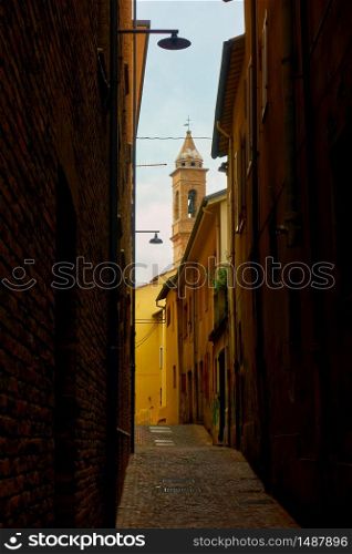 Perspective of old narrow street in Rimini, Italy